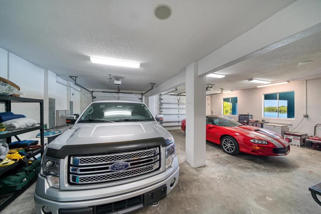 Oversized garage with Tesla charging station.