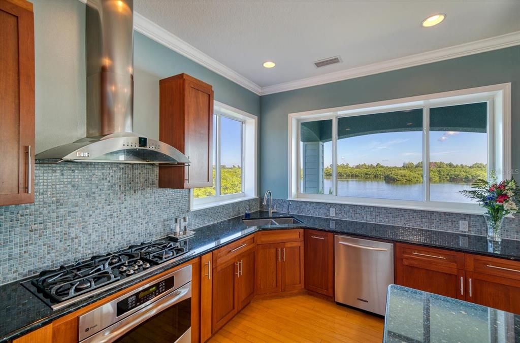 Imagine cooking your meals in this fabulous kitchen with the backdrop of the water and trees.