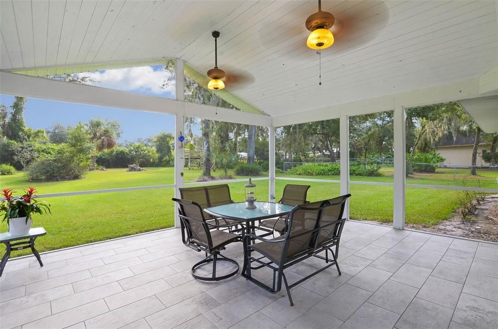 Enjoy outdoor living on the screened in lanai with full views of the backyard.