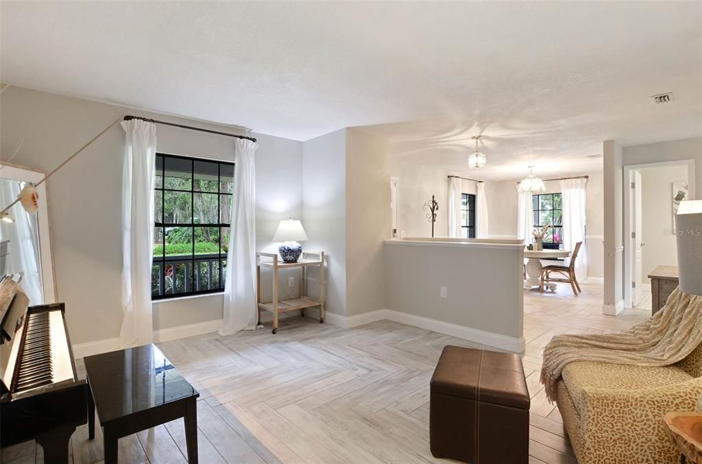 Front of home with dining area and living room.