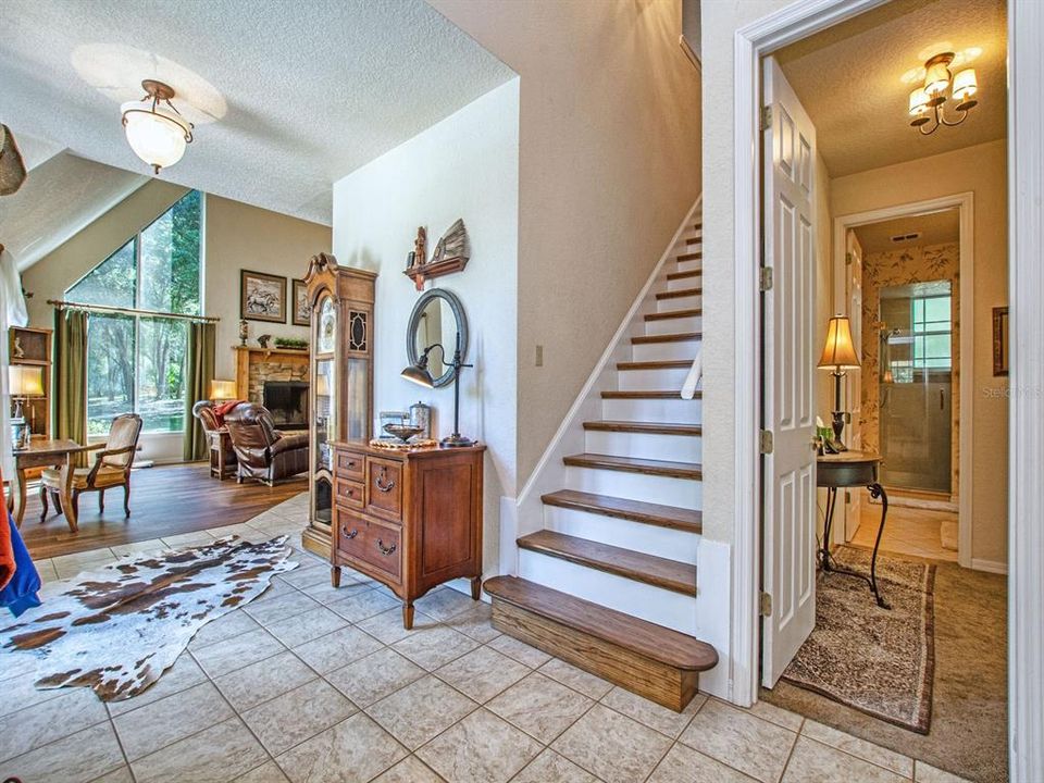 Front Foyer with staircase to upstairs and loft