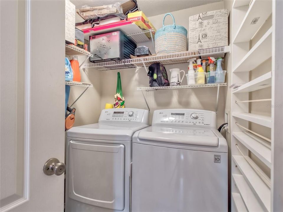 Large separate Laundry Room, with multiple storage shelves