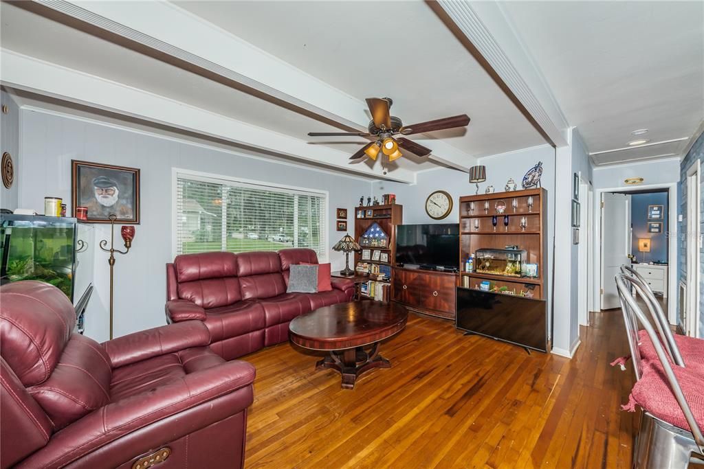 Light and Bright living room with original oak flooring