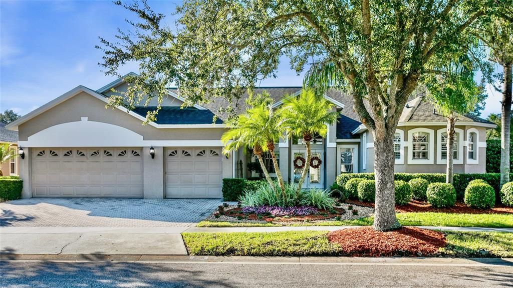 FRONT WITH 3 CAR GARAGE & PAVERED DRIVEWAY