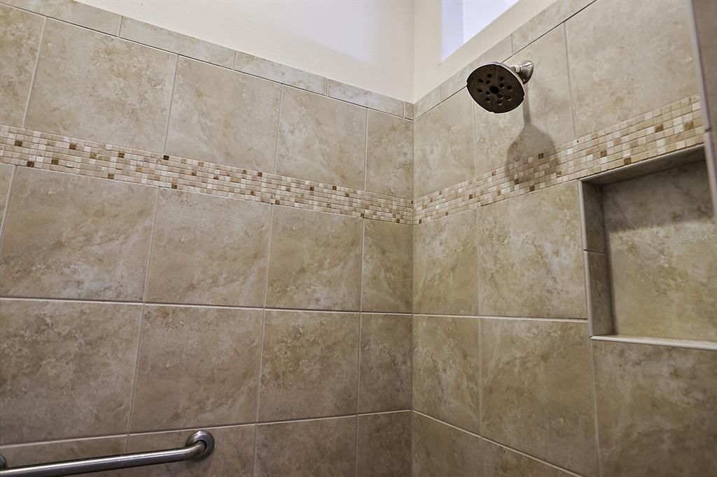 En suite with tiled walk in shower