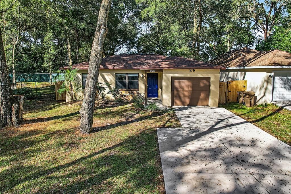 Adorable, affordable 2/2 country bungalow with garage, fenced yard, and no HOA!