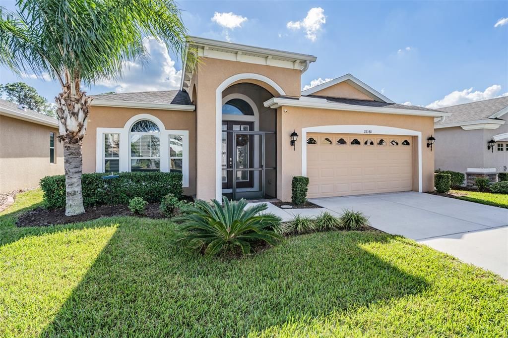 Screened front entry with pavers welcomes you HOME!