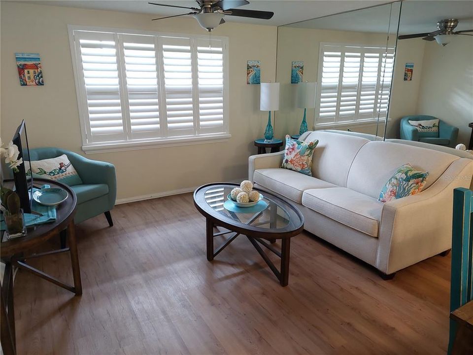 Beautiful and Totally Brand New!!Life Proof Laminated Flooring and Plantation Shutters Throughout.