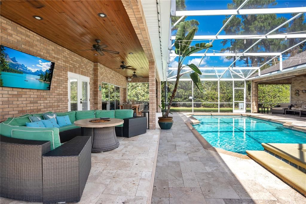 Sitting area on lanai with built in gas firepit