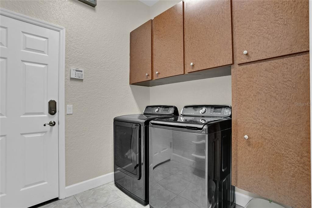 Laundry Room features Storage Cabinets