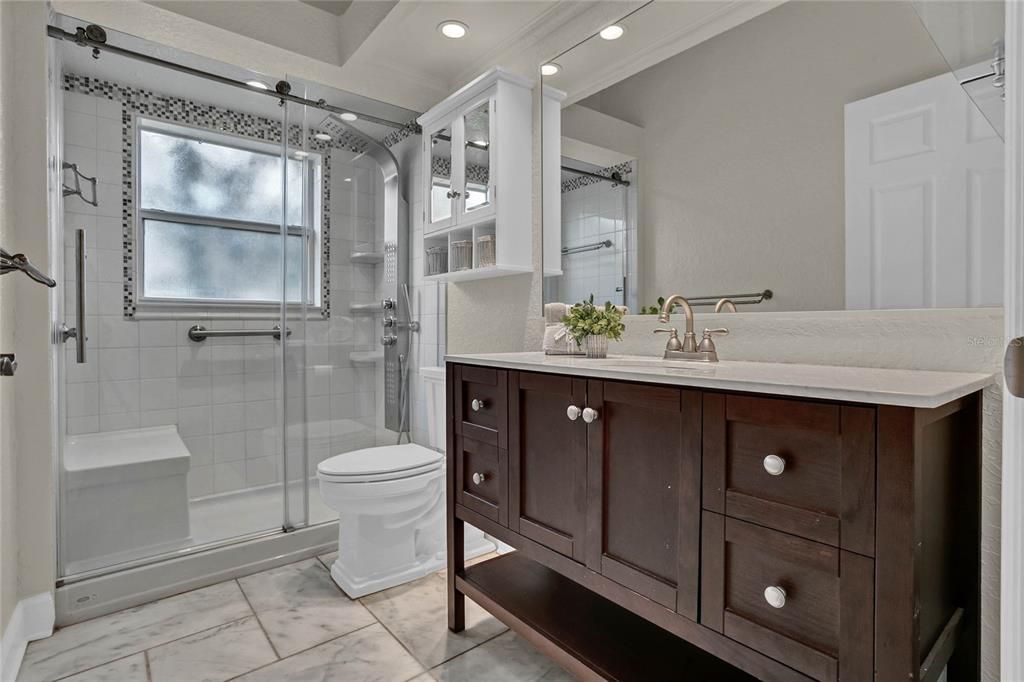 Remodeled Guest Bath with a Luxurious Body Spay Shower System.