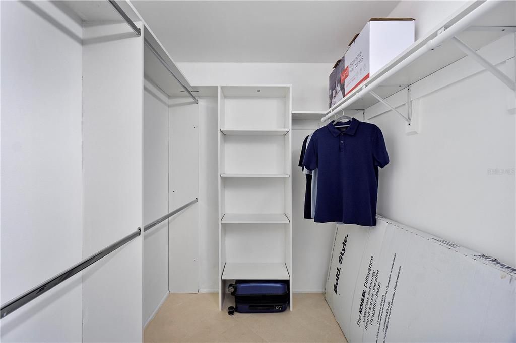 Primary Walk-In Closet with built-in shelfs & racks