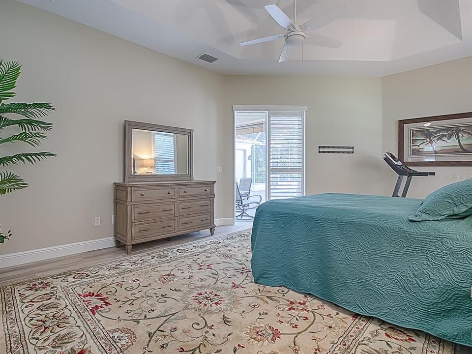 ON THE OPPOSITE SIDE OF THE HOME, YOU'LL FIND THE MASTER SUITE!  SLIDING GLASS DOORS LEAD TO THE POOL!