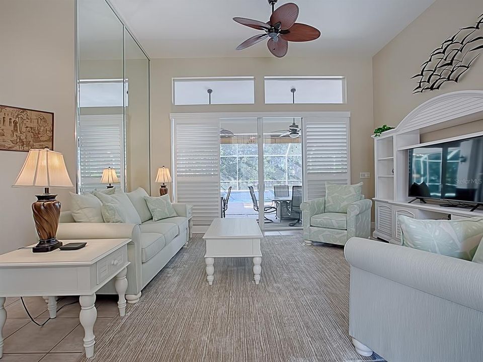 PLANTATION SHUTTERS ON THE SLIDING GLASS DOORS THAT OPEN TO THE SPACIOUS LANAI AND POOL!