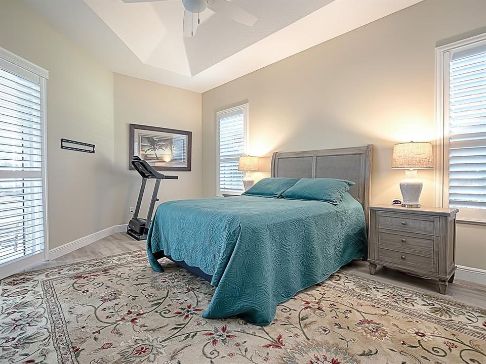 PORCELAIN TILE FLOORING, PLANTATION SHUTTERS AND A TRAY CEILING!