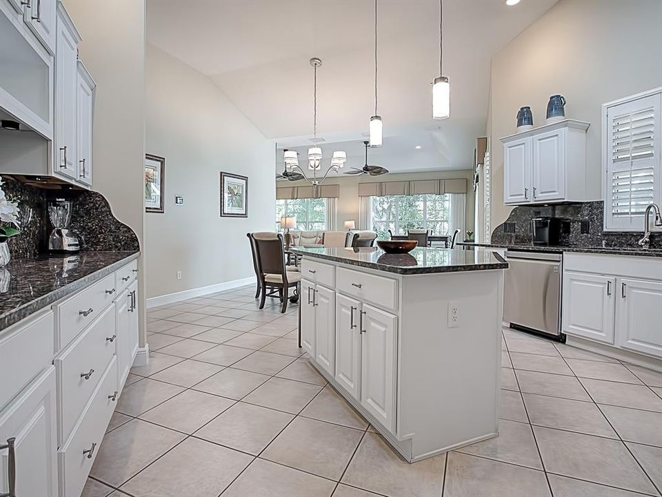 SPACIOUS KITCHEN WITH AN ISLAND WITH PENDANT LIGHTING PROVIDES MORE STORAGE AND ELECTRICAL!