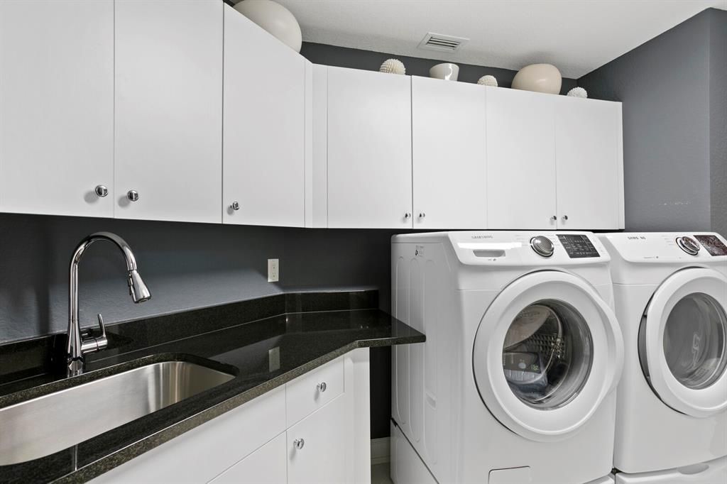 Laundry also has a stainless steel sink and houses the brand new tankless hot water heater!