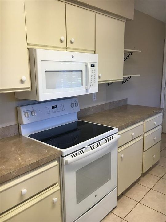 Kitchen showing Range and Microwave