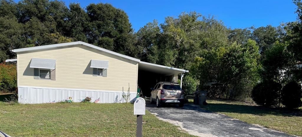 The carport leads to the back yard