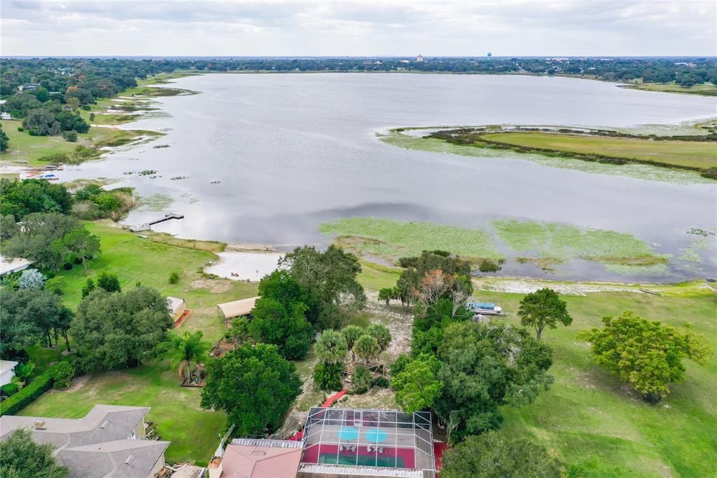 Aerial view of the home and the lakefront