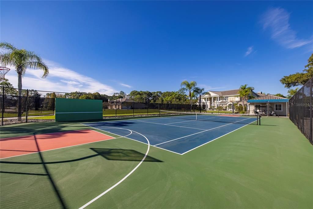 Tennis court or regulation sized basketball court.