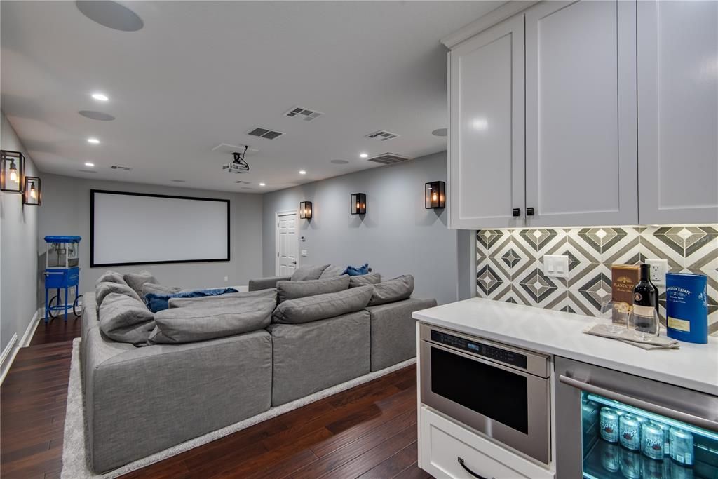 Movie night becomes an event!  Wet bar, beverage refrigerator and convection microwave drawer