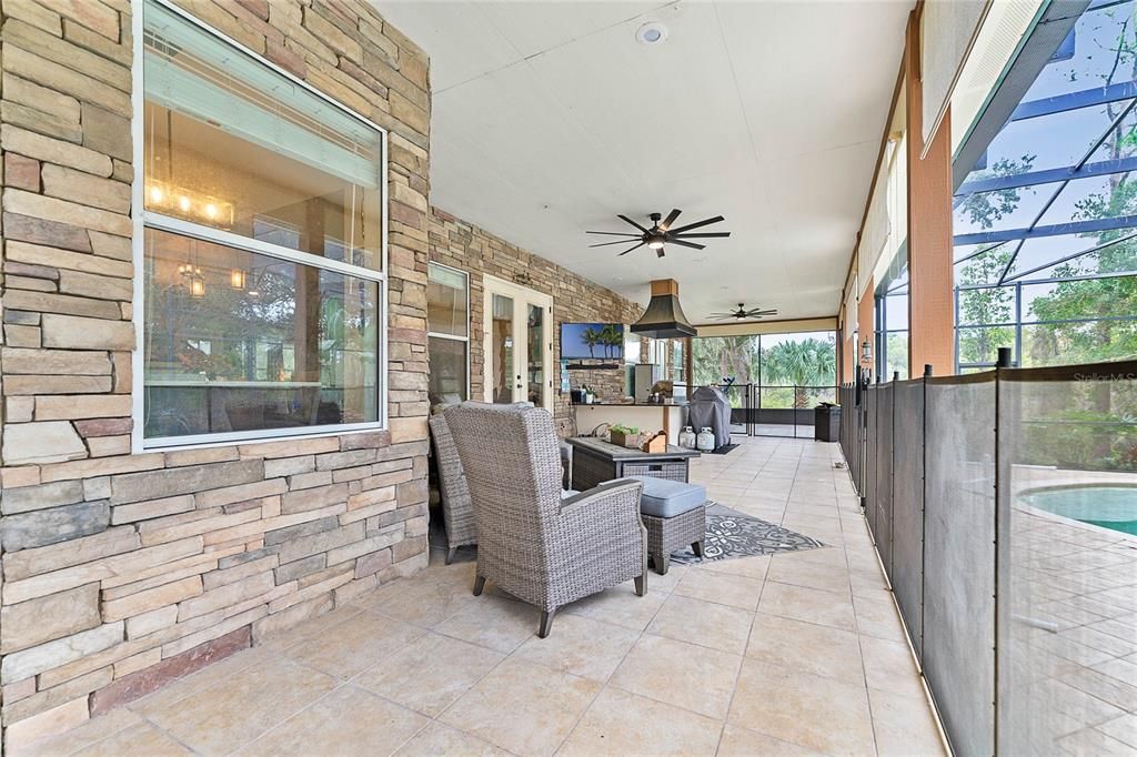 Custom pool with water wall and beach area