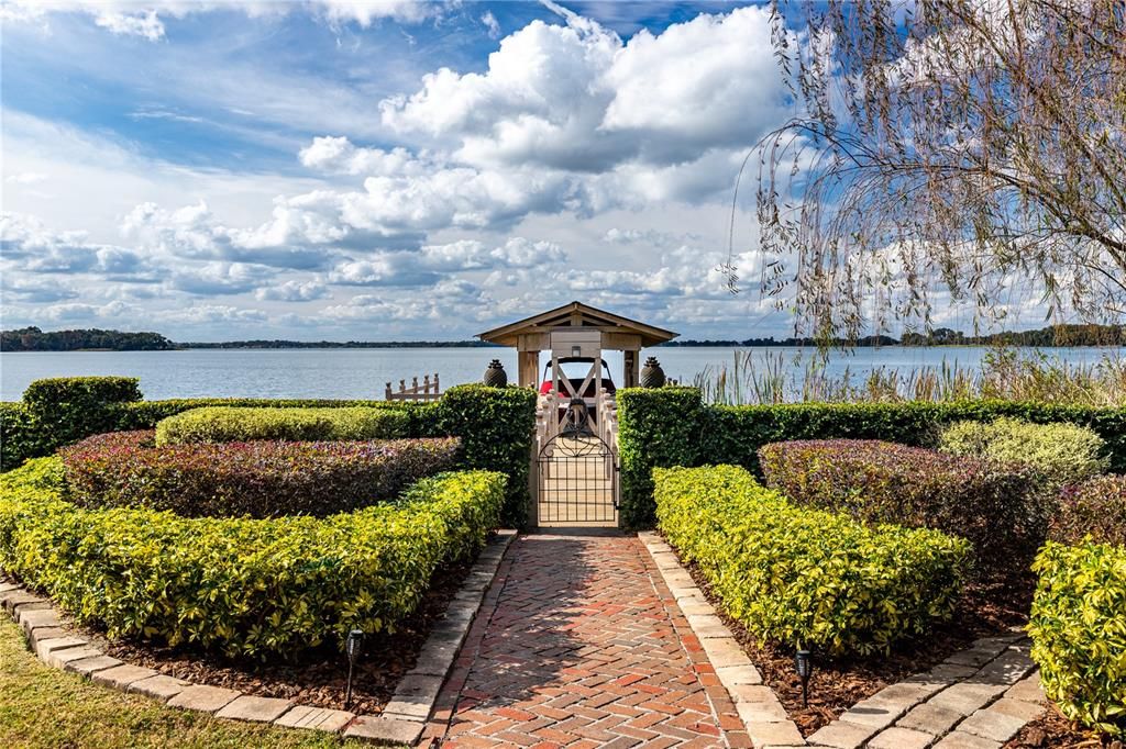 Beautifully Manicured Back Yard leading to Dock