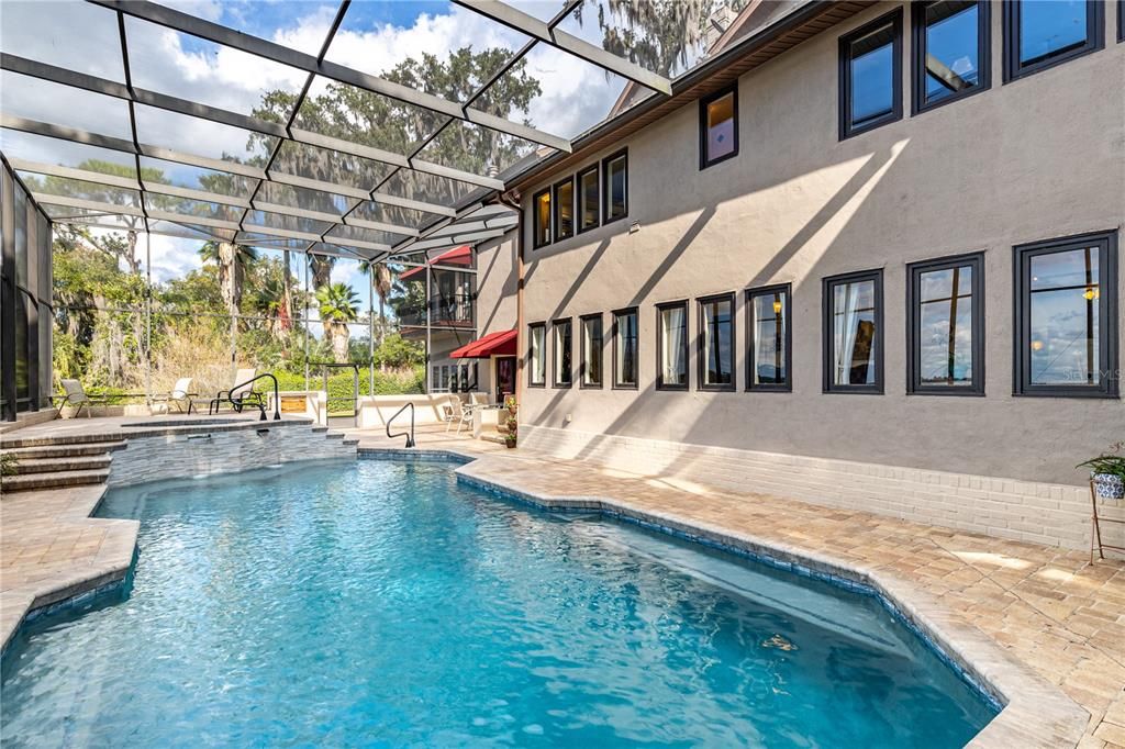 Pool Area and Deck - Notice "Wall of Windows" giving Amazing Views of the Lake and Pool area from the Home