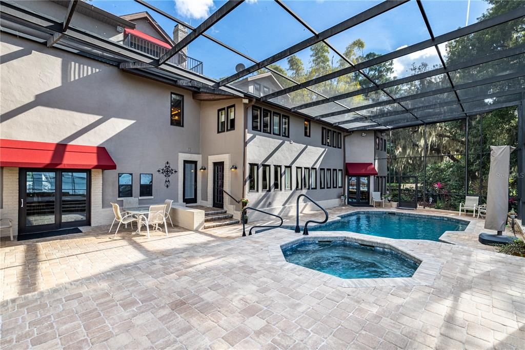 Pool Area showing Double Glass Door Entrance from Family Room as well as two other entrances from home