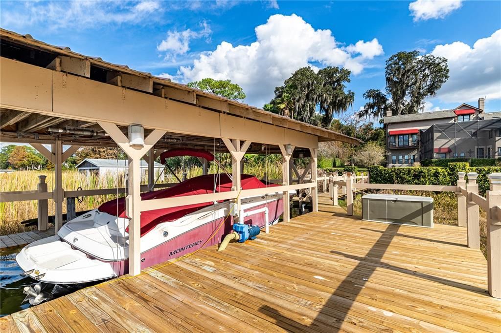 Covered Boathouse with Electric Lift and Deck Recently Renovated
