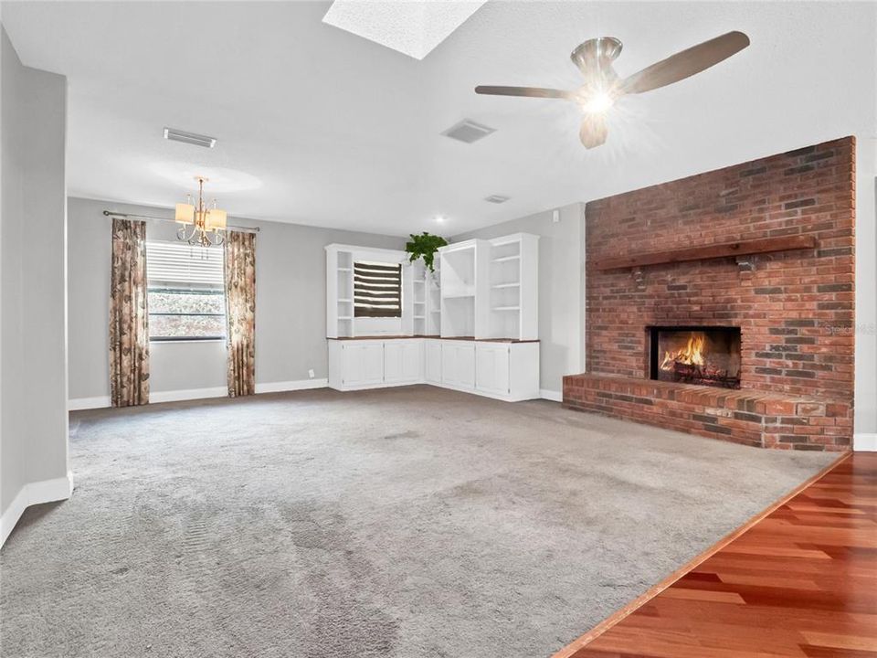 Family Room off the kitchen with fireplace and wall unit (not attached so can be removed)