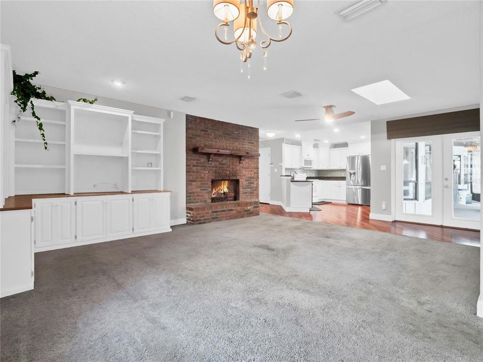 Family room with French doors leading to pool lanai