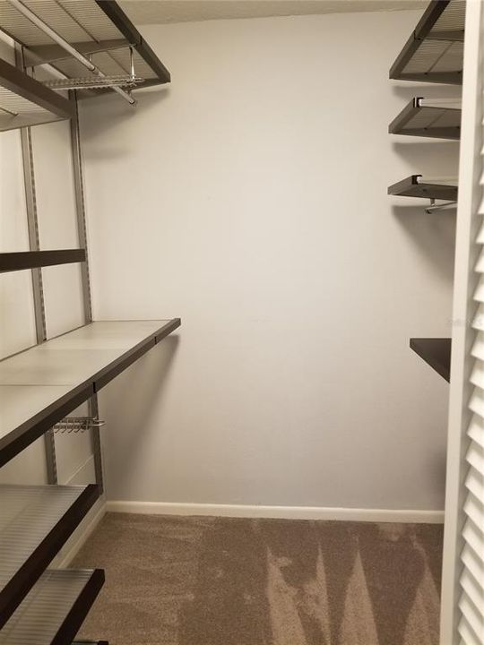 The Master Bedroom Walk in Closet has unique shelving