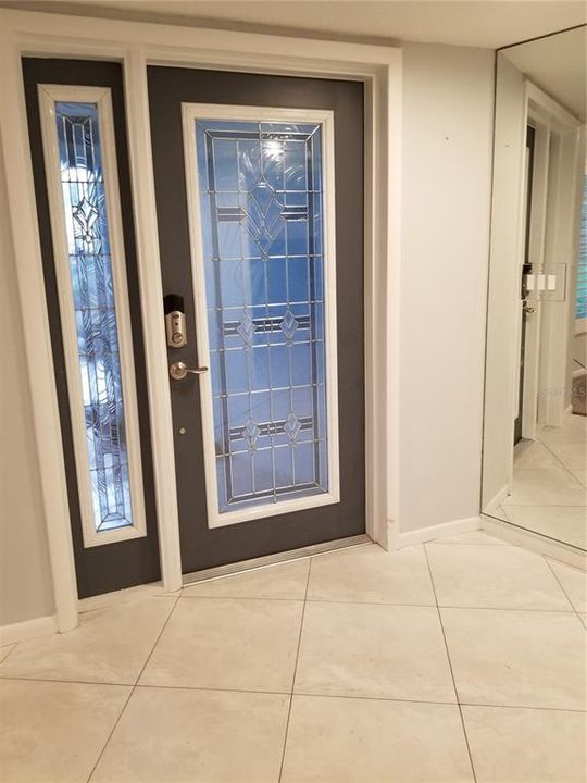 Enter the Foyer through a decorative glass Front Door