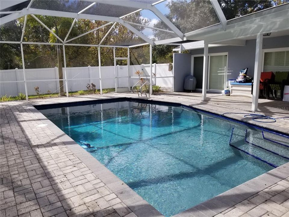 The Pool is not too large and has brick pavers that surround it.