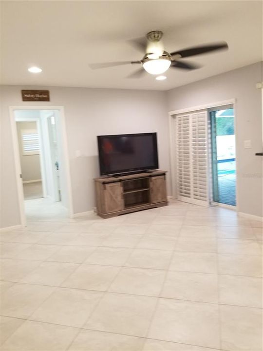Large 13x18 ft. Family Room is entrance to Pool is conveniently placed next to the kitchen so you don't miss any of the big game