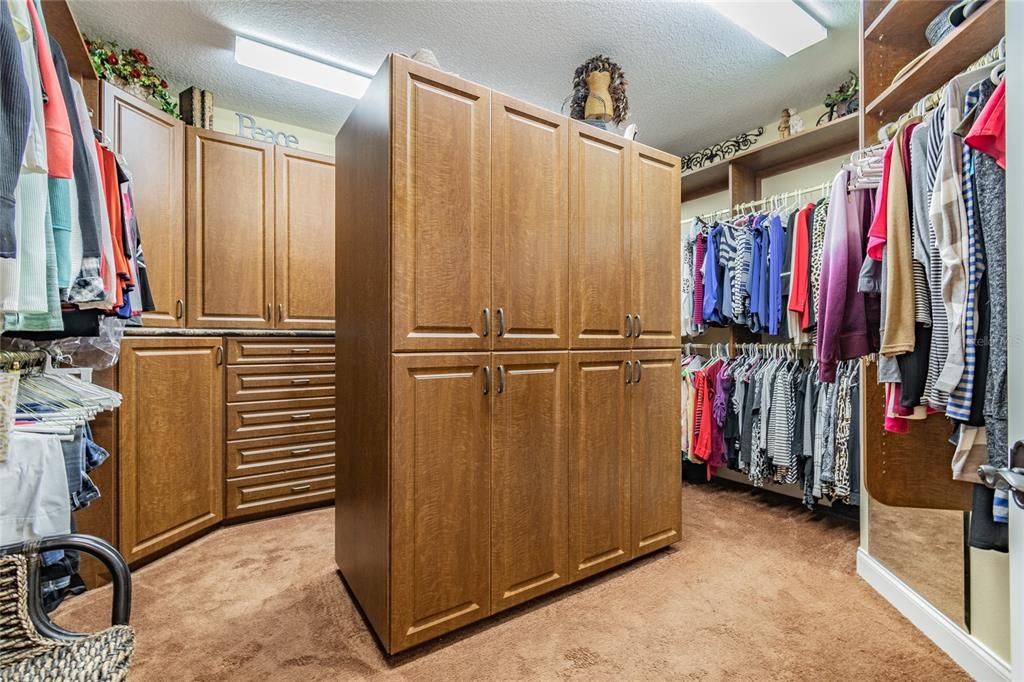 Enormous 14 ft wide custom closet for "HER" (easily reimagined as a separate room having multiple purposes)