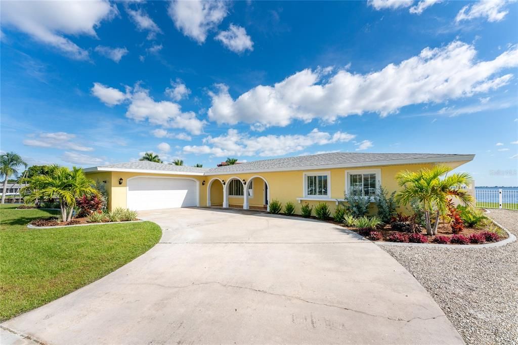 Front of home with extra room to park boats and toys