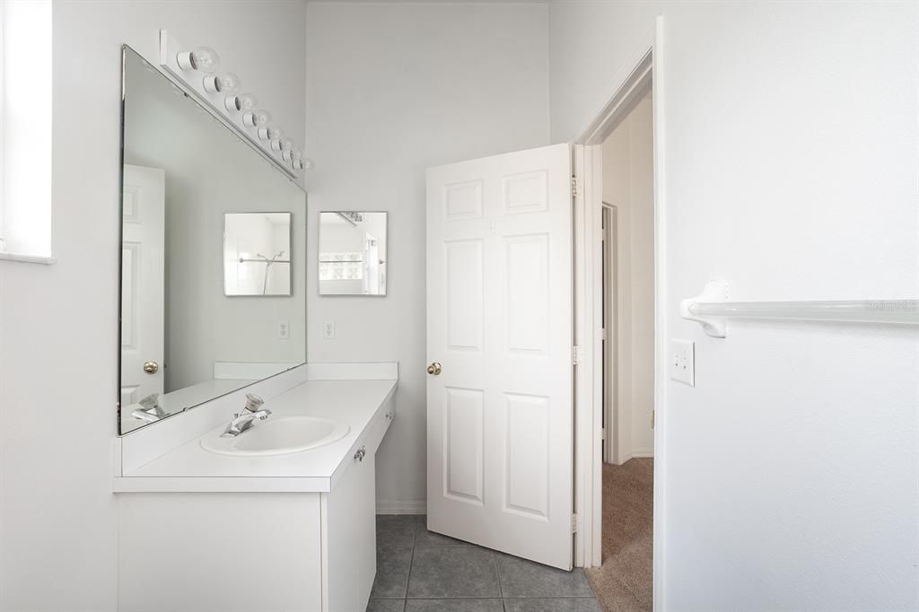 The master bath is bright and ready to provide plenty of storage and counterspace for your daily rituals.