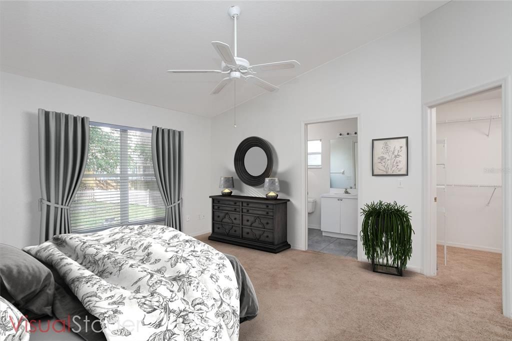 The natural light as well as the high ceilings enhance the master bedroom, and the large walk in closet provides an abundance of storage space.