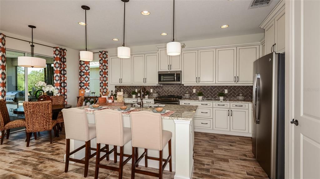 Island Kitchen overlooking Casual Dining **MODEL HOME SHOWN**