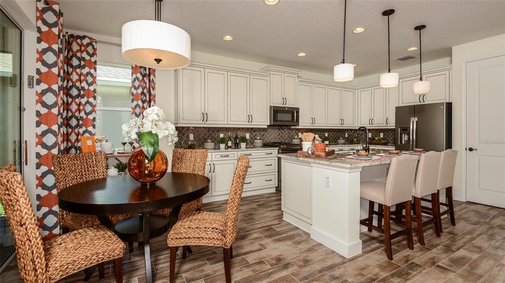 Casual Dining overlooking Kitchen **MODEL HOME SHOWN**