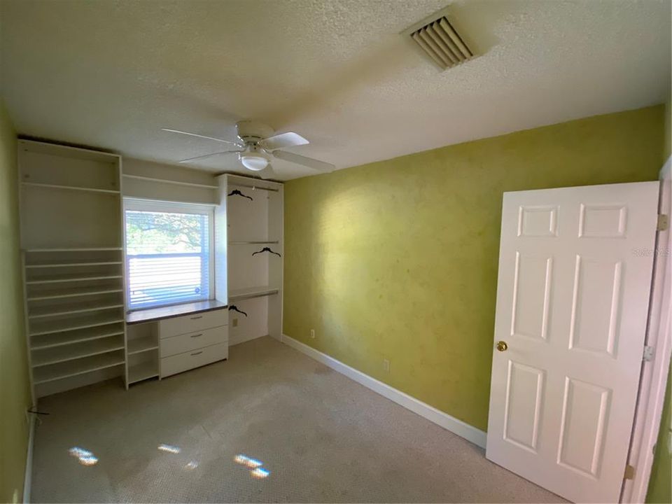 fourth bedroom with custom built in closet