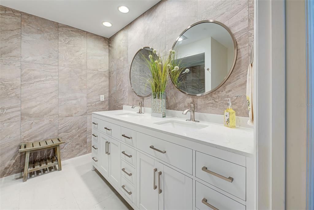 Dream bathroom with a sleek sophisticated look, walk-in shower. double vanities, ample counter space and drawers.