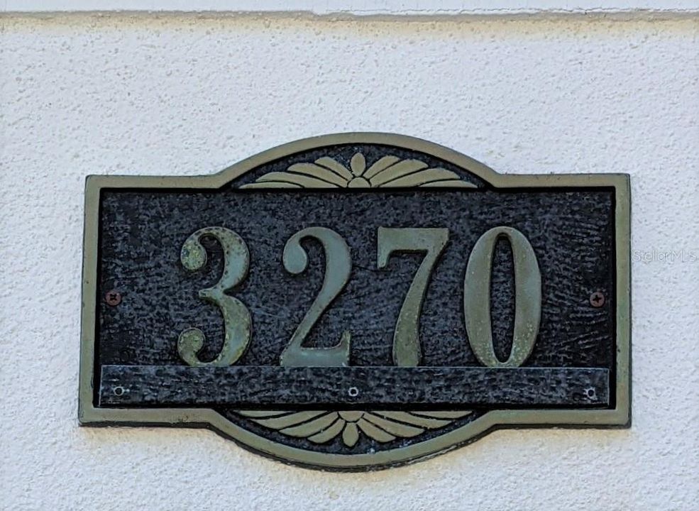 3270 plaque over garage door.