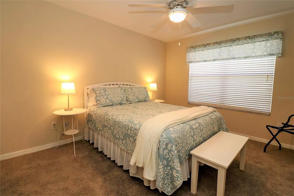 Front guest bedroom has a nice Queen complete bed, 2 night stands and a bench.  They all stay with the home.