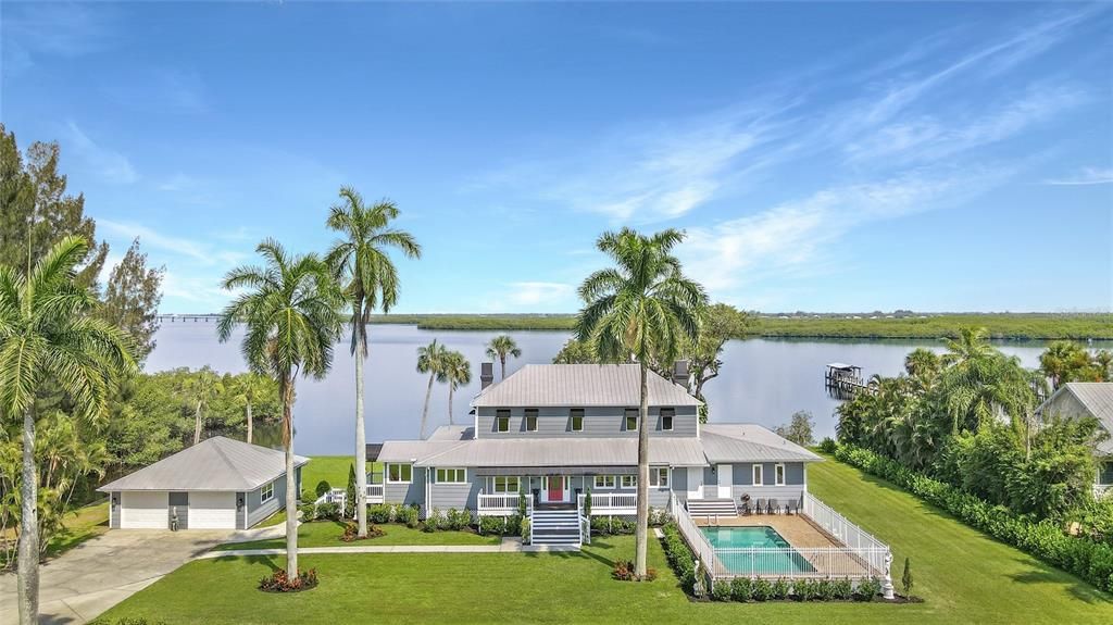 The George Brown Mansion - an Olde Florida Estate nestled on 2.15 magnificent acres of unobstructed water views on the Peace River. Built in 1910 but updated and renovated for the perfect blend of old and new!