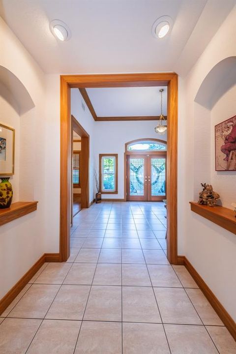 Hallway to Family room with art niches