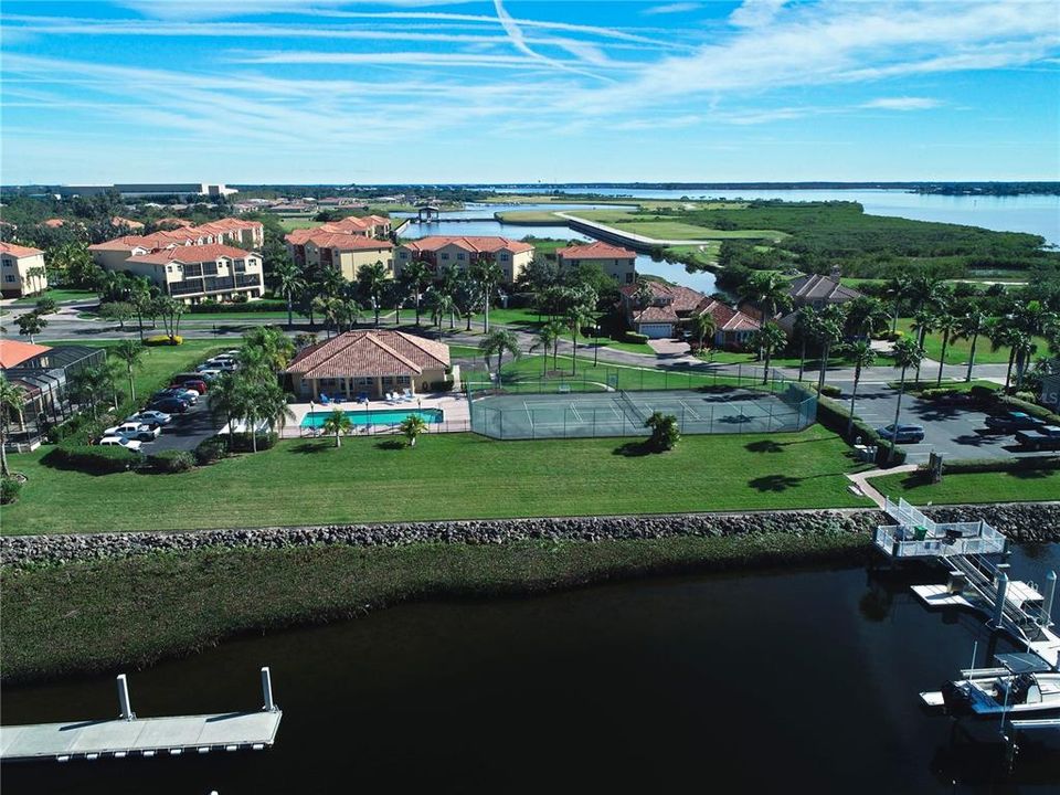 Amenity center with tennis/pickle-ball courts, pool, & marina.